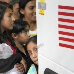 Immigrants from El Salvador and Guatemala who entered the country illegally board a bus after being released from a family detention center in San Antonio, Texas in 2015. (Eric Gay / Associated Press)
