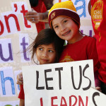 Los Angeles Unified School District students Alexandria Marek, 8, right, and Kerala Seth, 4, left, protested the district’s cuts to the high-profile Mandarin Immersion Program at Venice’s Broadway Elementary school in March. (Al Seib / Los Angeles Times)