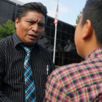 The LA Times Reports (8/9/16): Aldo Waykam, a Mayan language interpreter, meets recently with Vinicio Nicolas, 15, outside the federal immigration court in Anaheim before Vinicio's asylum hearing. Vinicio speaks Kanjobal, the language used in his village in the highlands of Guatemala. (Mark Boster / Los Angeles Times)